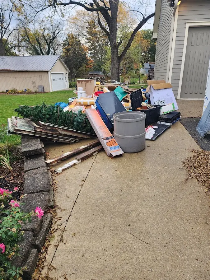 Dumpster being loaded with debris for Commercial Dumpster Rental in Whitestown